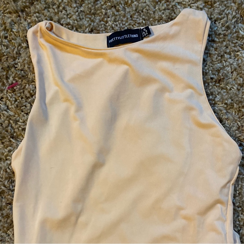 Pretty Little Thing peach color bodysuit.